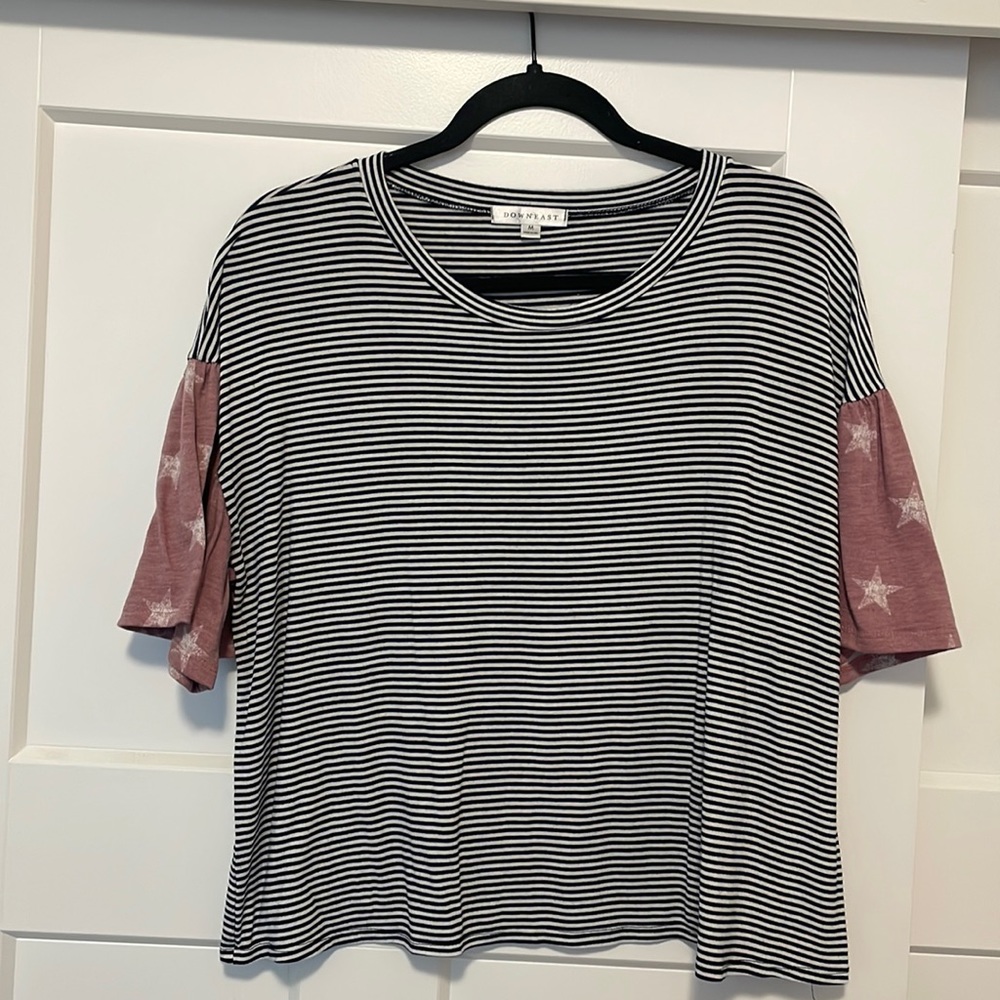 Striped shirt with star sleeves. Very cute and comfortable. Easy to dress up.